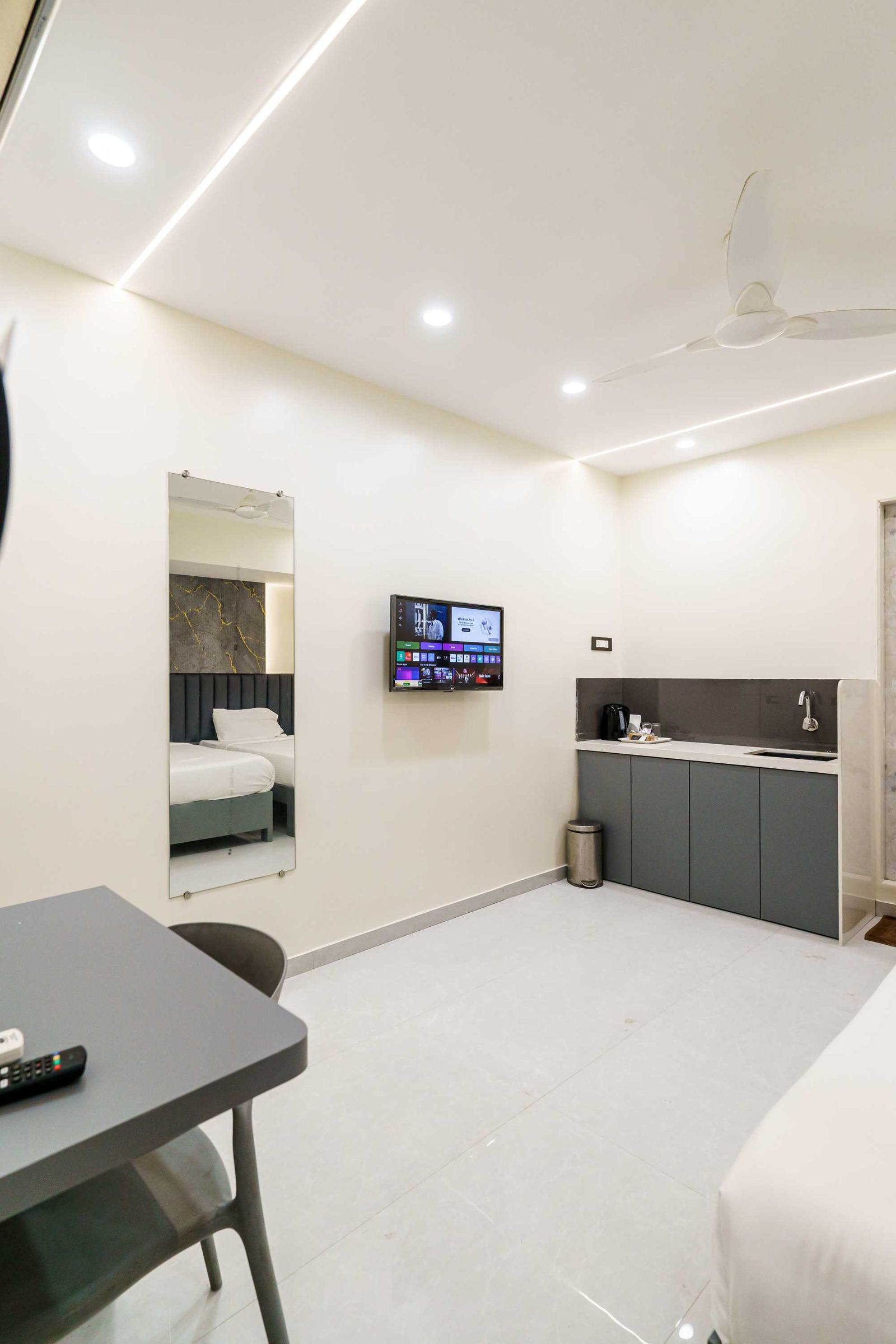 Teak Studio kitchenette wall — Lake Bloom Residency Powai
