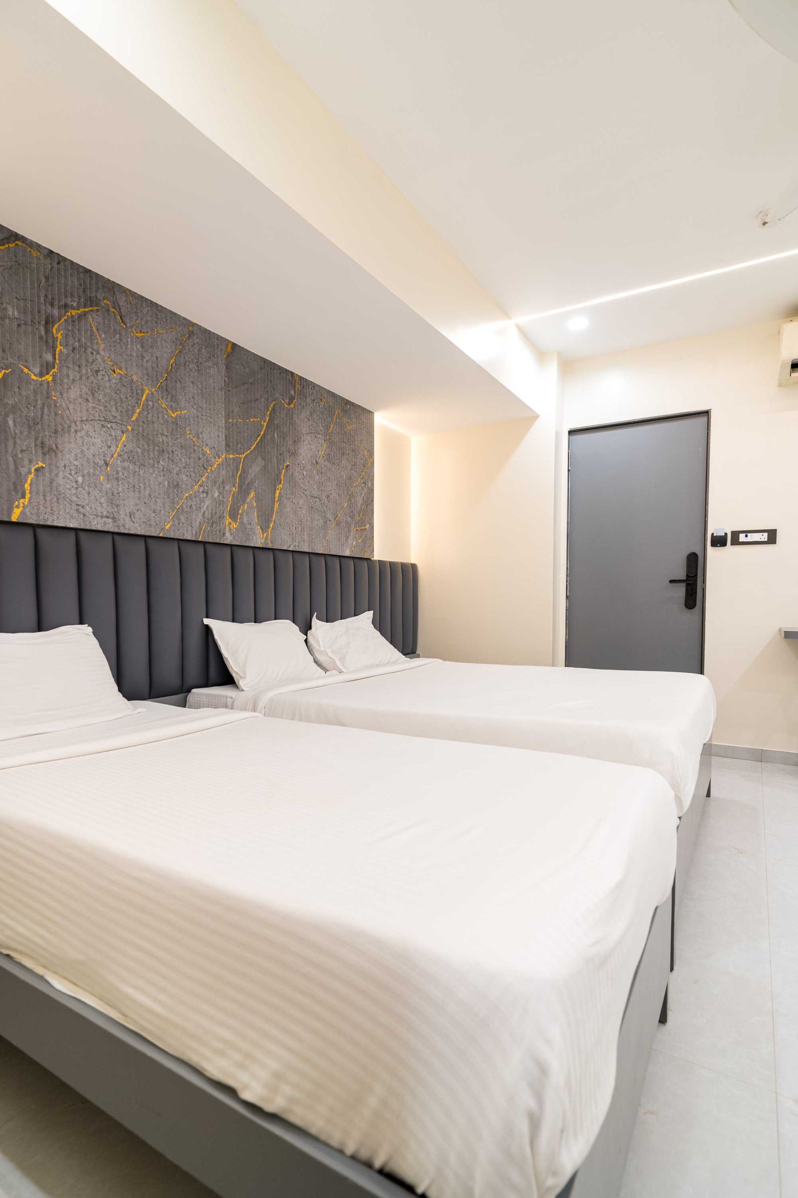 Banyan Trio at Lake Bloom Residency Powai — bed with sofa-cum-bed for the third guest