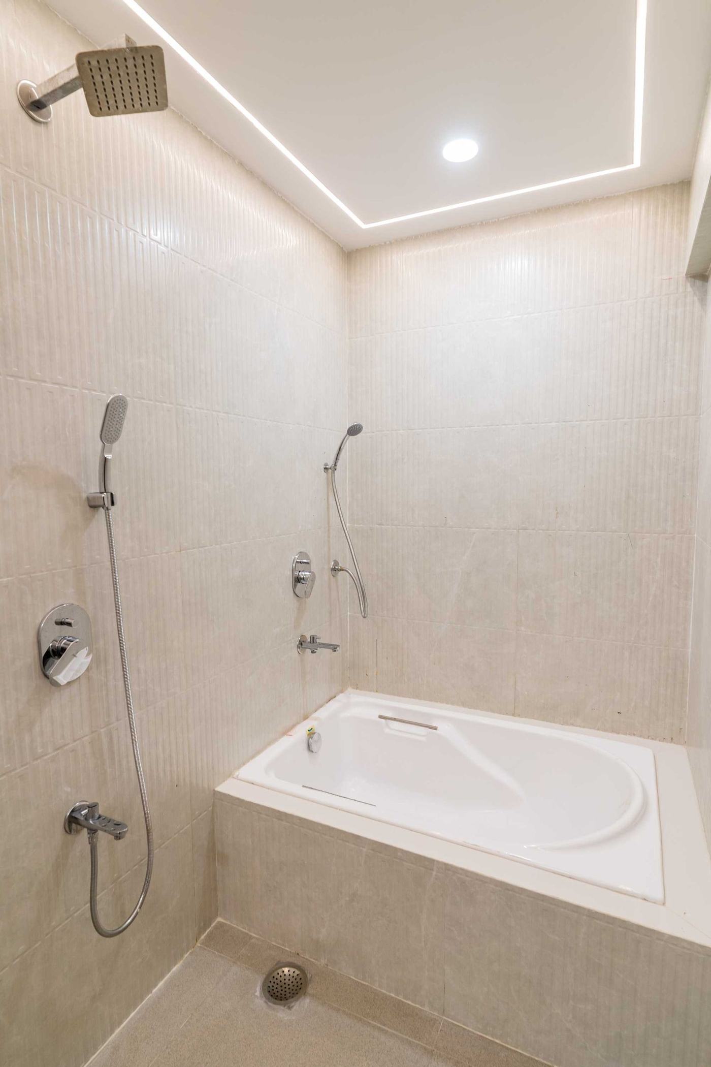 The Mahogany Soak at Lake Bloom Residency Powai — signature studio with bathtub