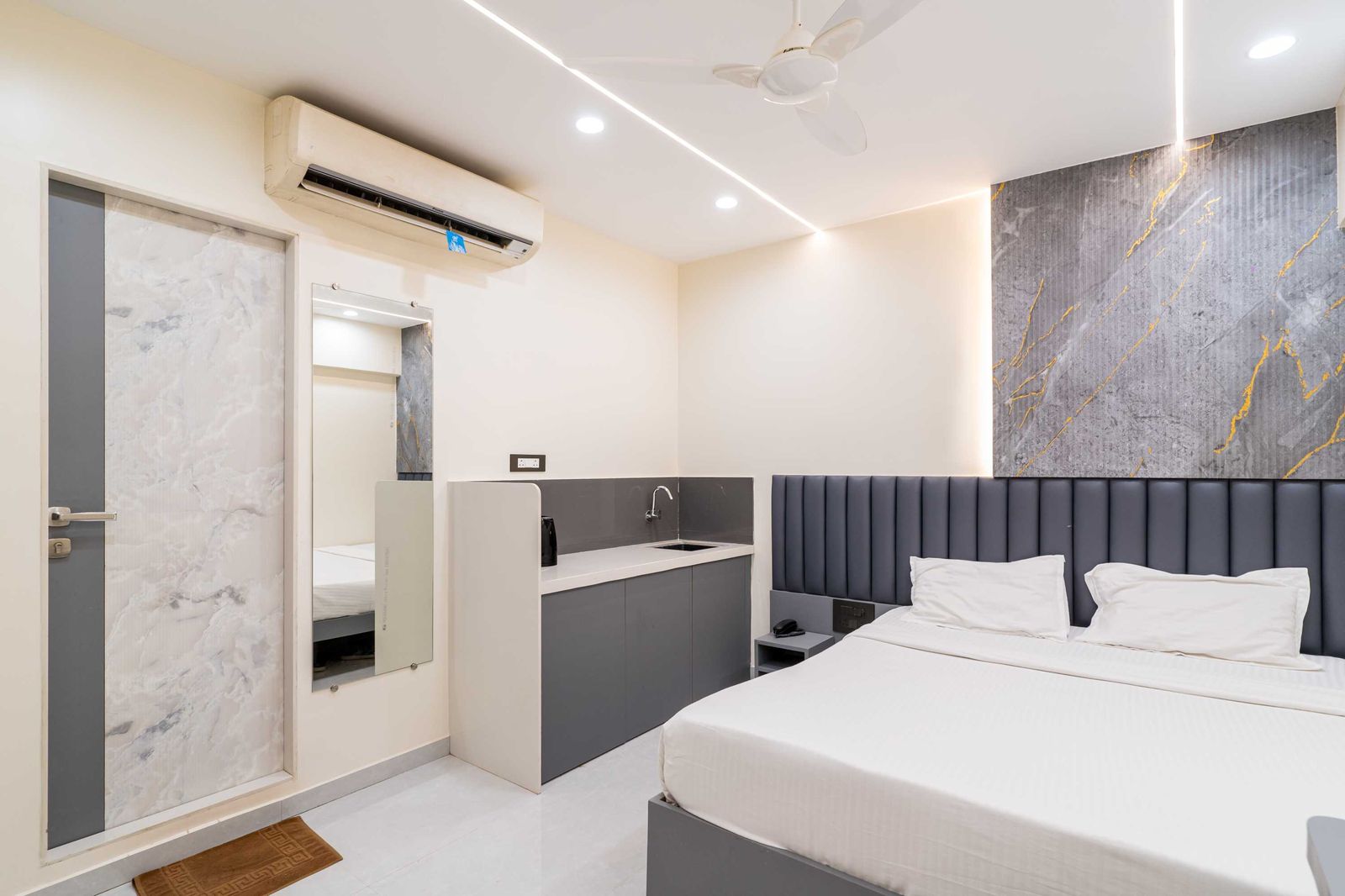 Teak Studio at Lake Bloom Residency Powai — studio room with kitchenette