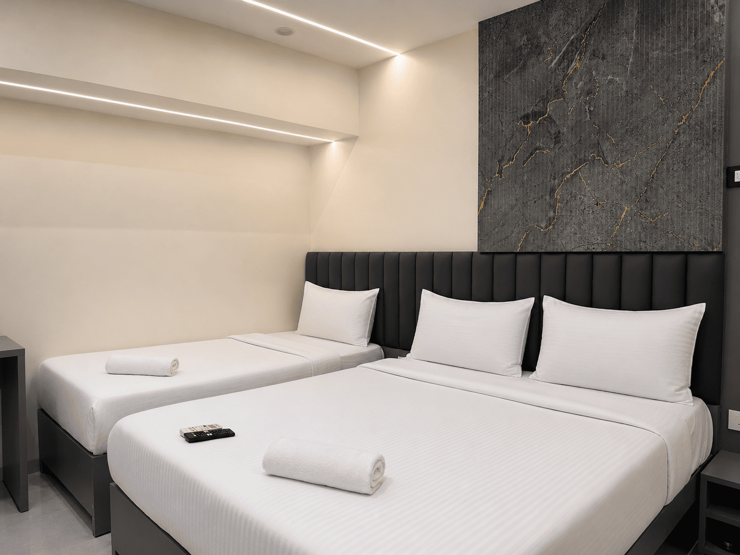 Banyan Trio at Lake Bloom Residency Powai — bed with sofa-cum-bed for the third guest